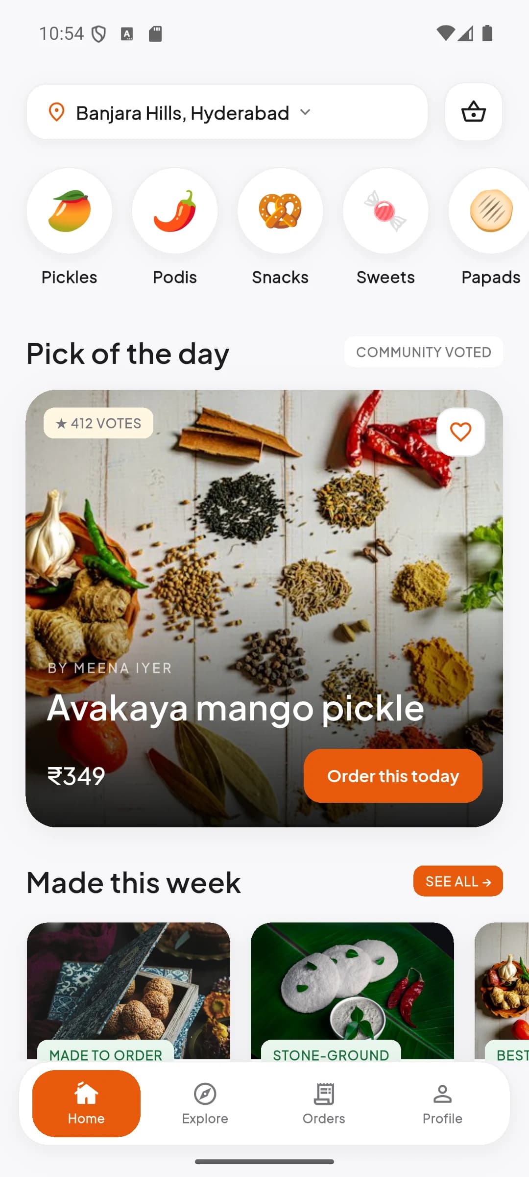 The CraveLink home feed: a location header set to Banjara Hills, craving shortcuts for pickles, podis, snacks and sweets, and a pick of the day.